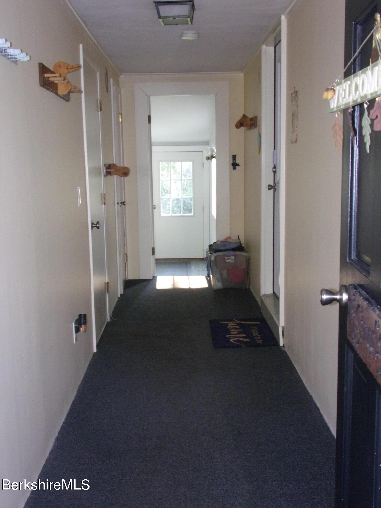1435 River Road Clarksburg, MA 01247 - Photo 14 of 55 a view of a hallway with windows and couch