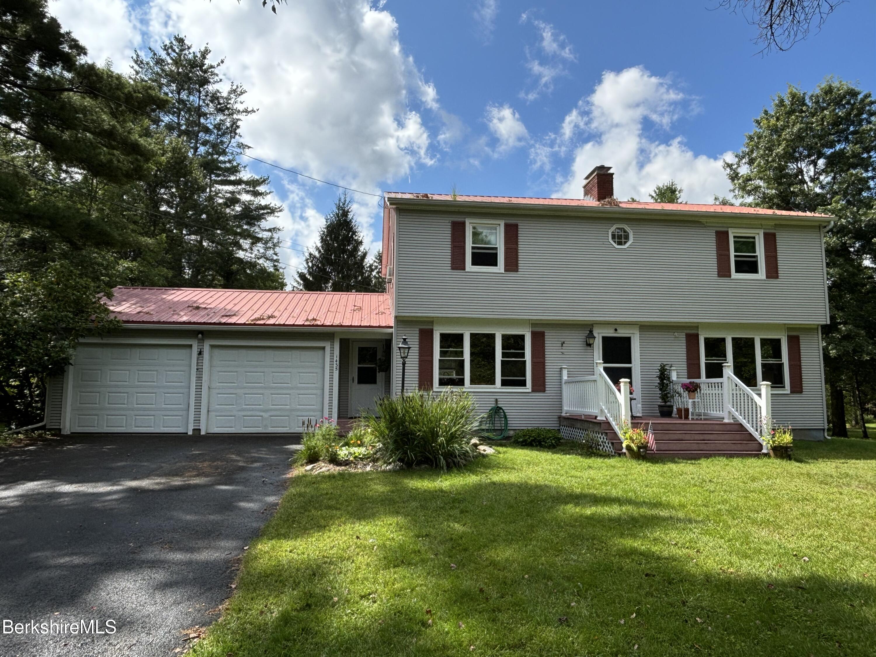 1435 River Road Clarksburg, MA 01247 - Photo 2 of 55 a front view of a house with garden