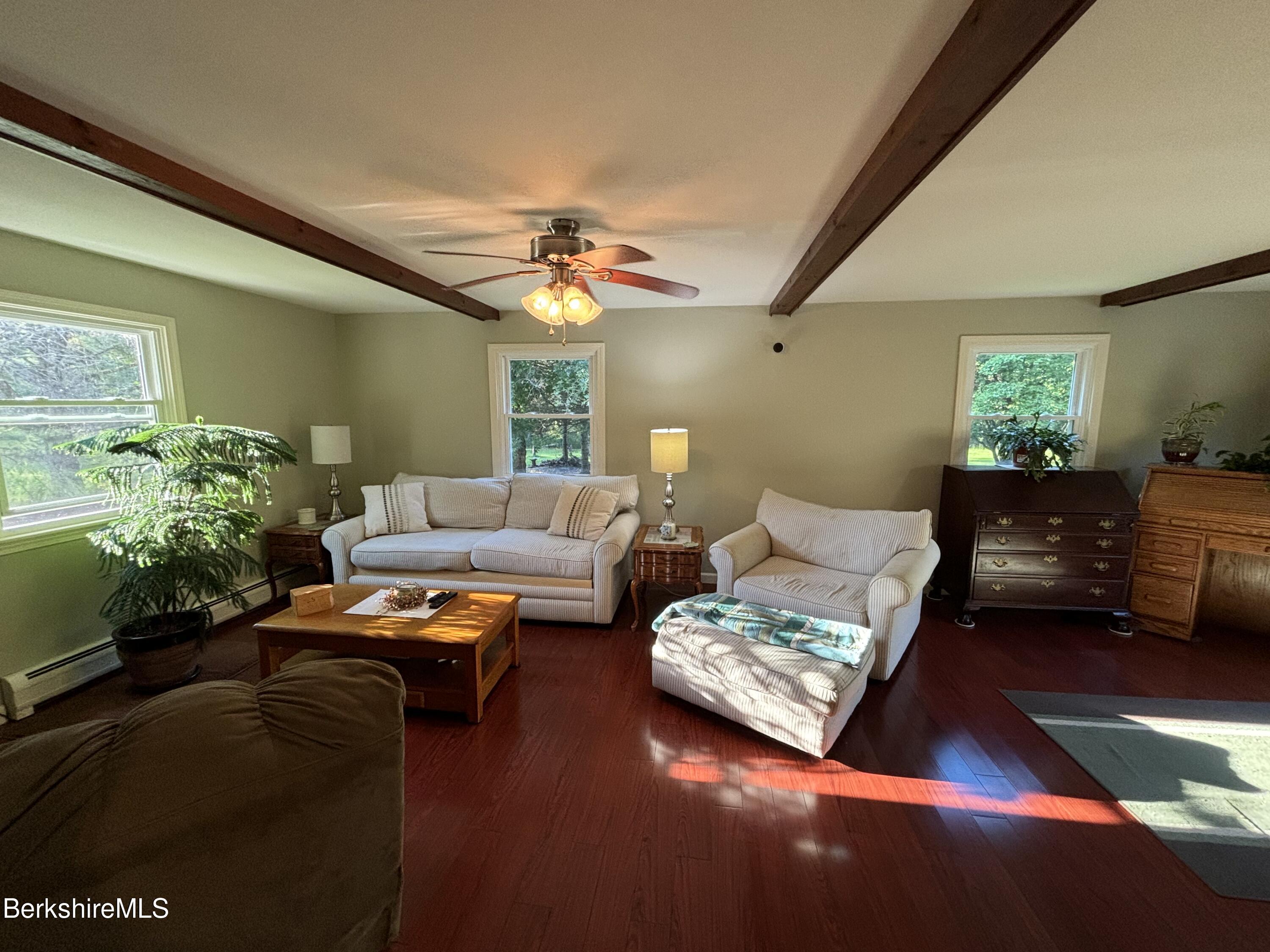 1435 River Road Clarksburg, MA 01247 - Photo 25 of 55 a living room with furniture and a chandelier