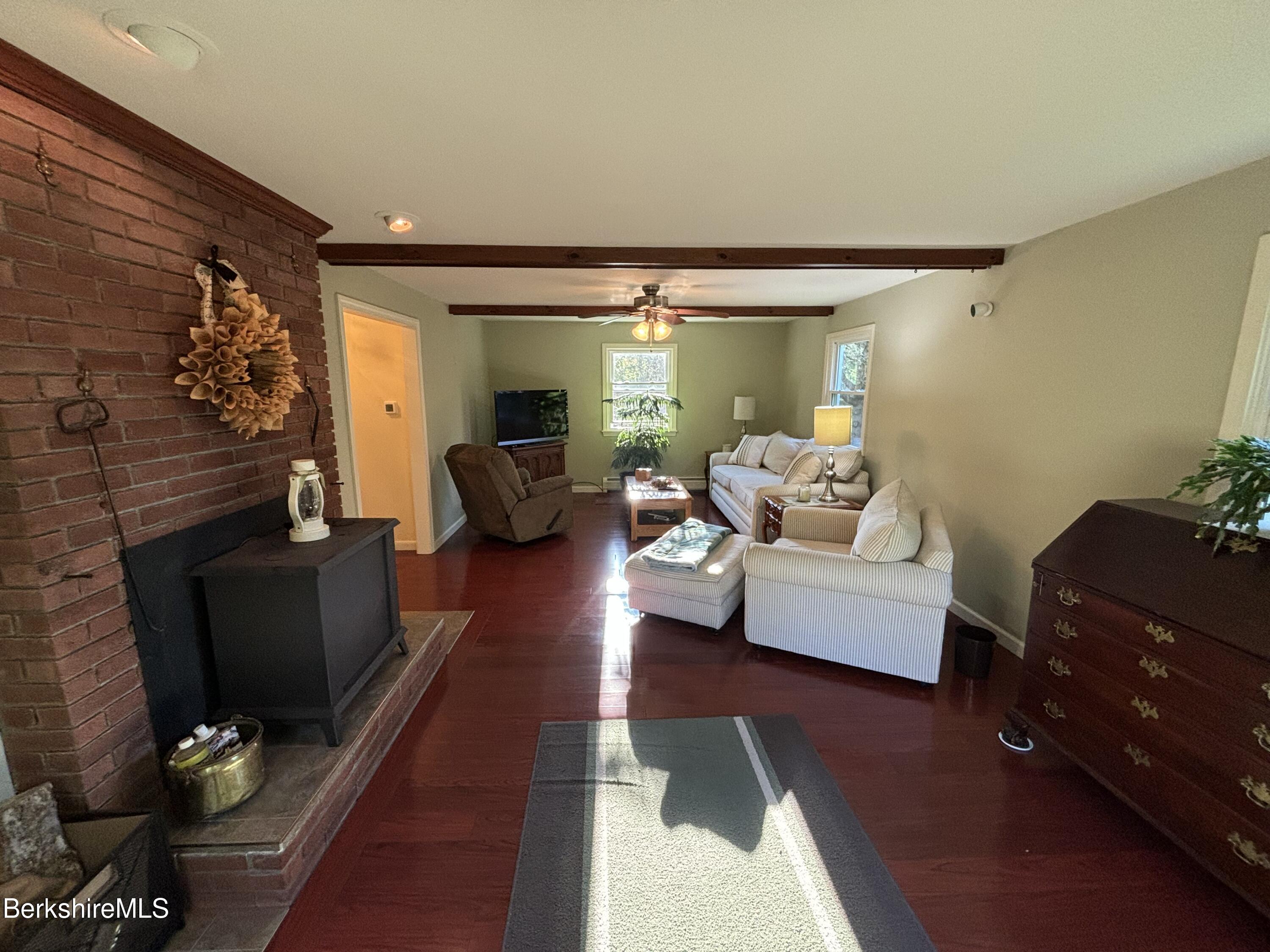1435 River Road Clarksburg, MA 01247 - Photo 26 of 55 a living room with furniture and a fireplace