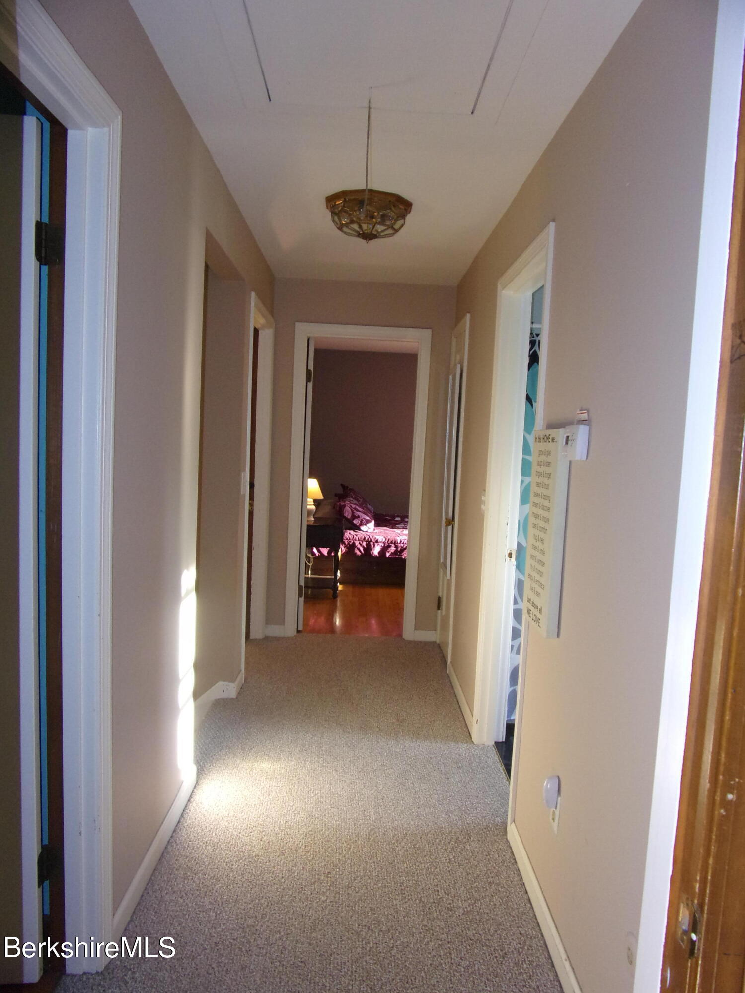 1435 River Road Clarksburg, MA 01247 - Photo 34 of 55 a view of a room with a hanging light and hardwood floor