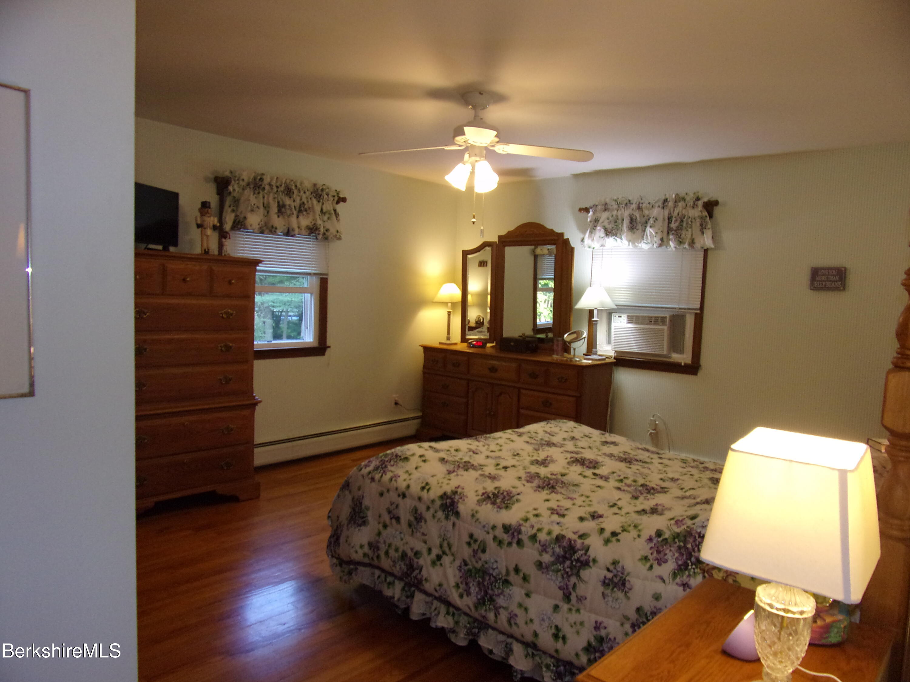 1435 River Road Clarksburg, MA 01247 - Photo 35 of 55 a bedroom with a bed and wooden floor