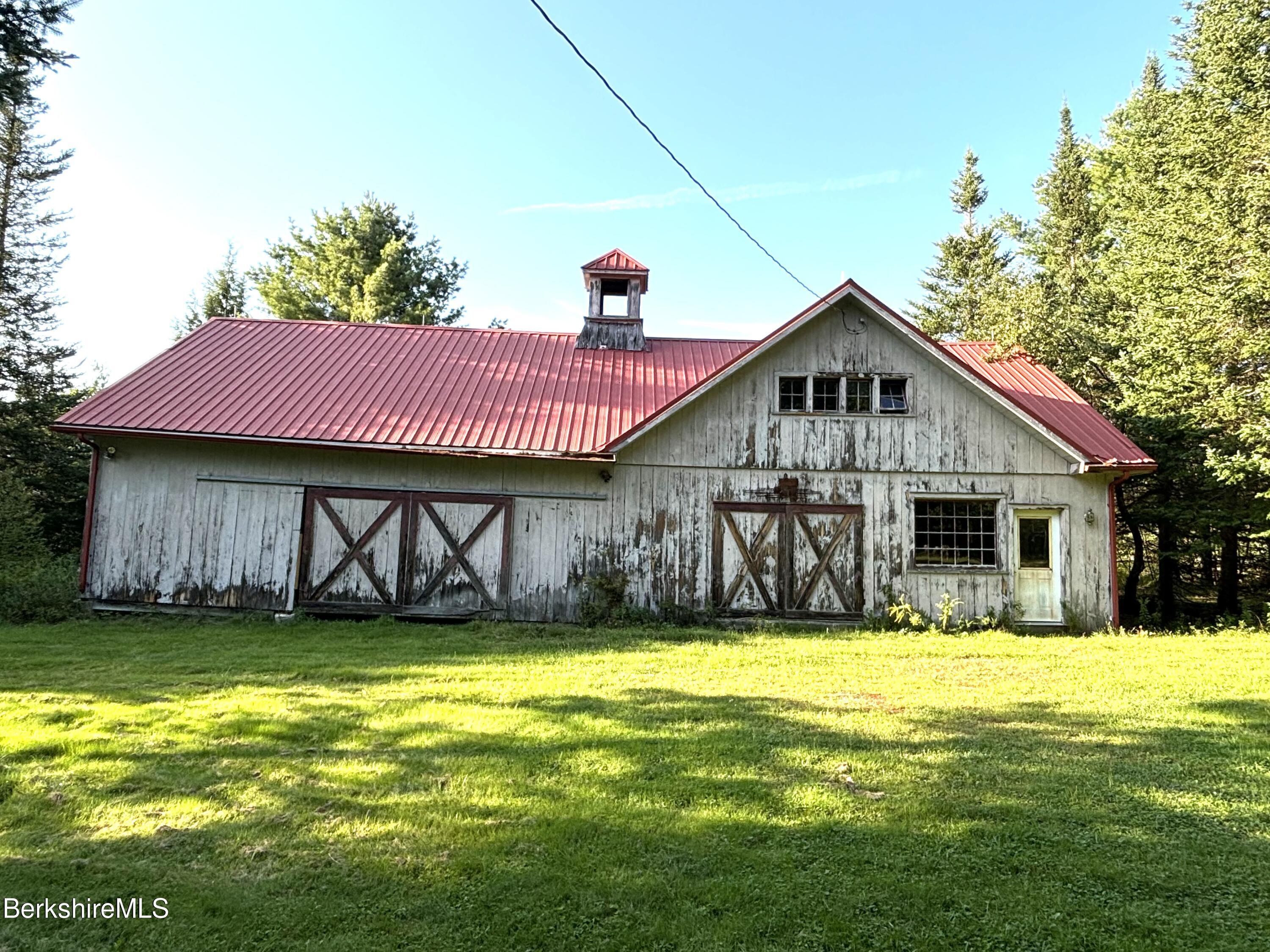 1435 River Road Clarksburg, MA 01247 - Photo 8 of 55 a front view of a house with a yard
