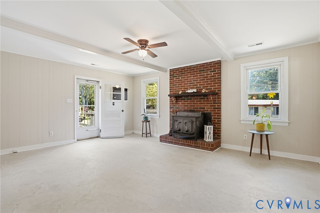 2403 Omega Road Henrico, VA 23228 - Photo 12 of 39 a view of a livingroom with a fireplace and window