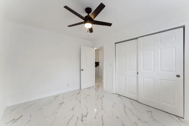 an empty room with closet area