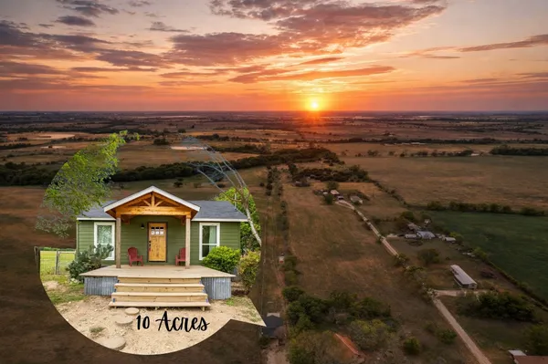 a view of house with yard