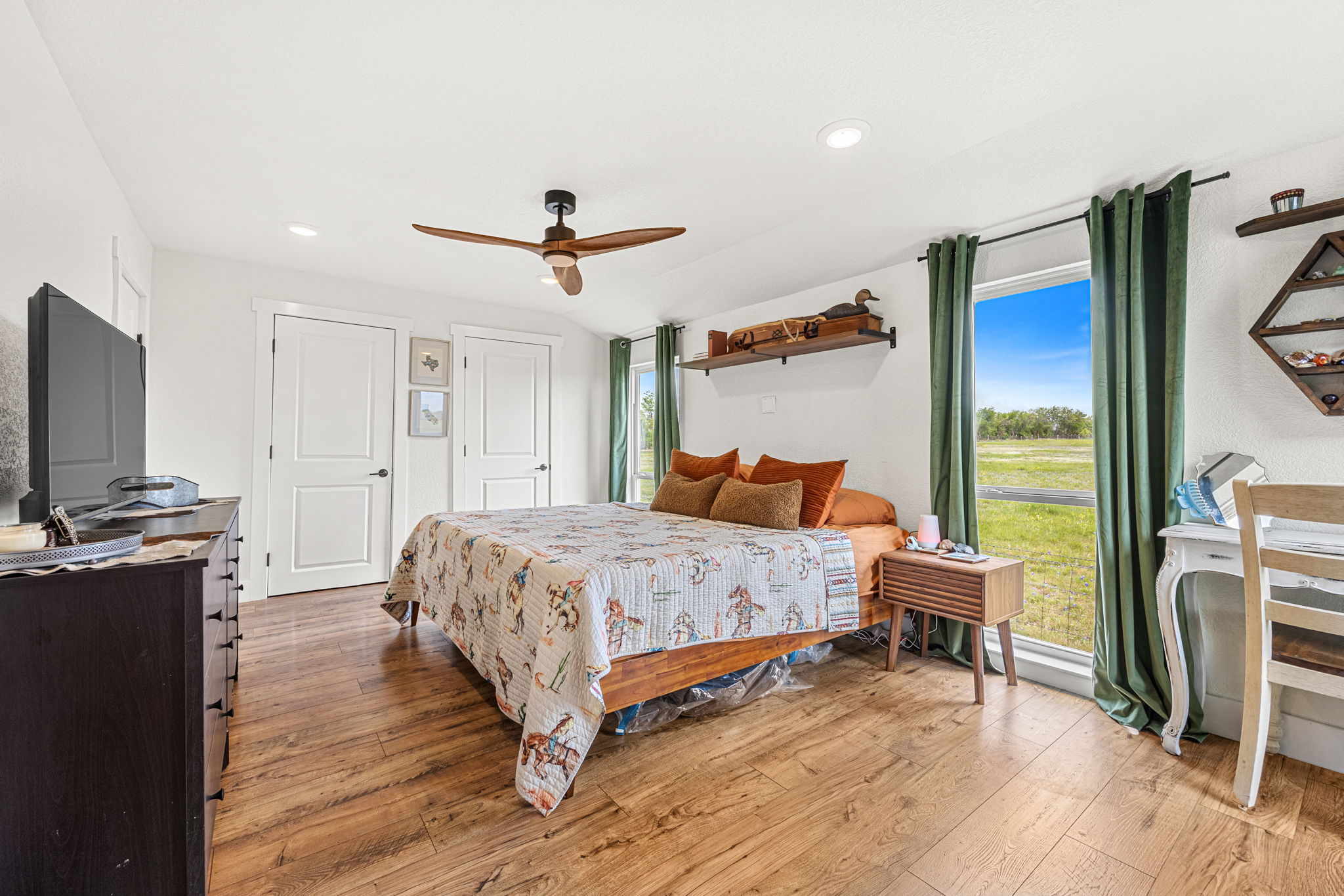 13390 Bendle Road Troy, TX 76579 - Photo 13 of 30 a bedroom with a bed and a flat screen tv