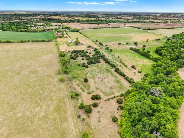a bedroom with furniture and wooden floor