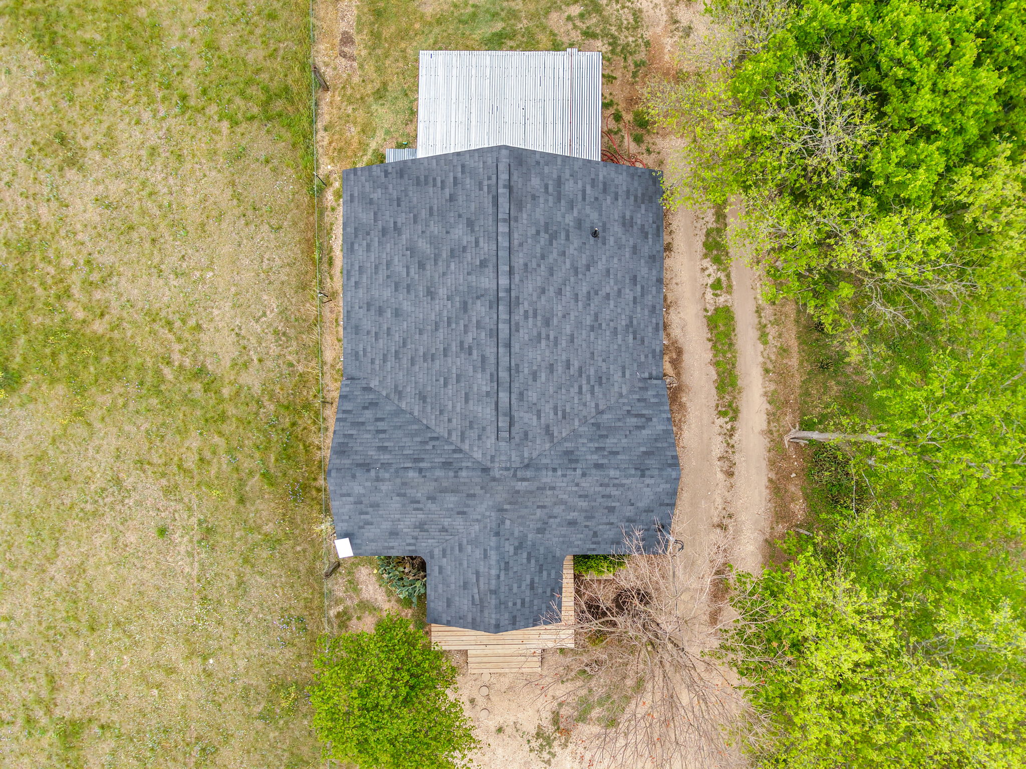 13390 Bendle Road Troy, TX 76579 - Photo 7 of 30 a brick building with a yard and covered with trees
