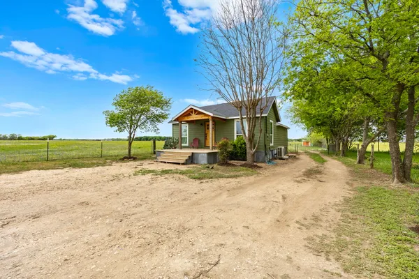 a kitchen with stainless steel appliances a refrigerator sink and cabinets