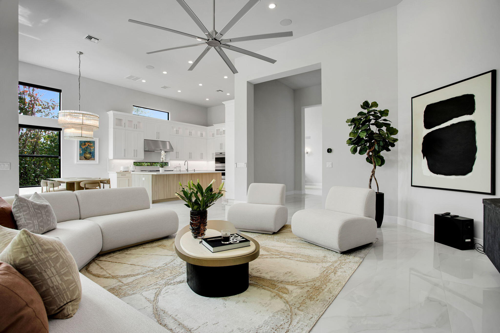 6903 Northwest 28th Avenue Boca Raton, FL 33496 - Photo 18 of 69 a living room with furniture a chandelier and a fireplace
