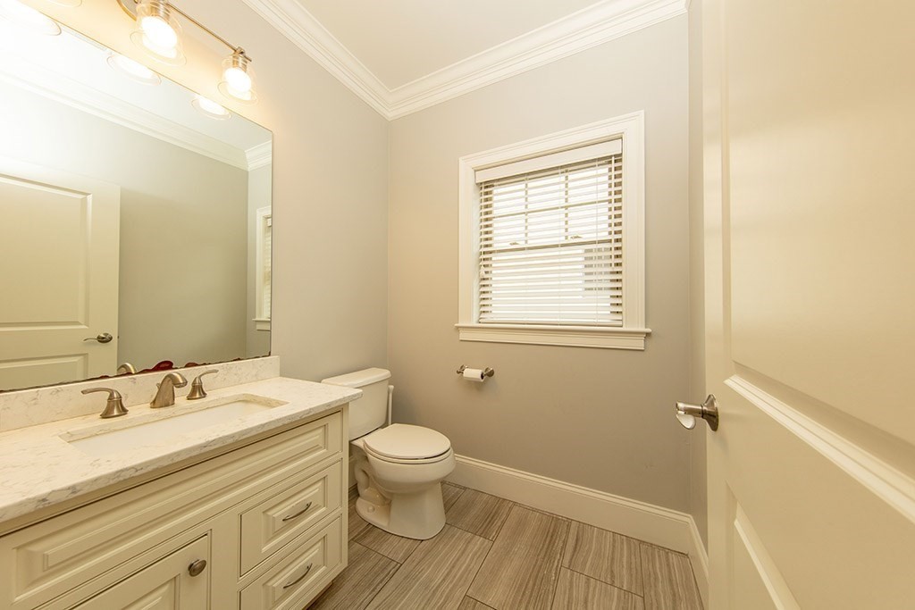 33 Liberty Avenue Lexington, MA 02420 - Photo 9 of 30 a bathroom with a sink and a mirror