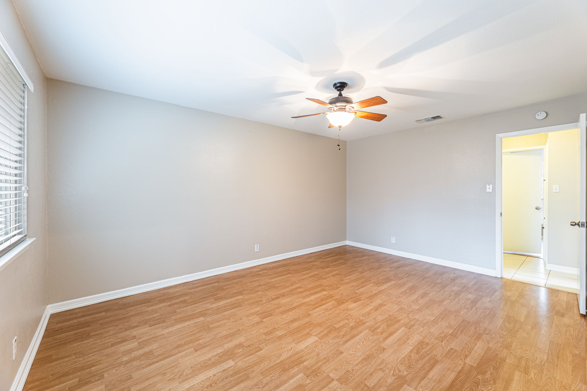 12914 Pegasus Street Austin, TX 78727 - Photo 16 of 30 Spare room with light wood-style flooring and ceiling fan