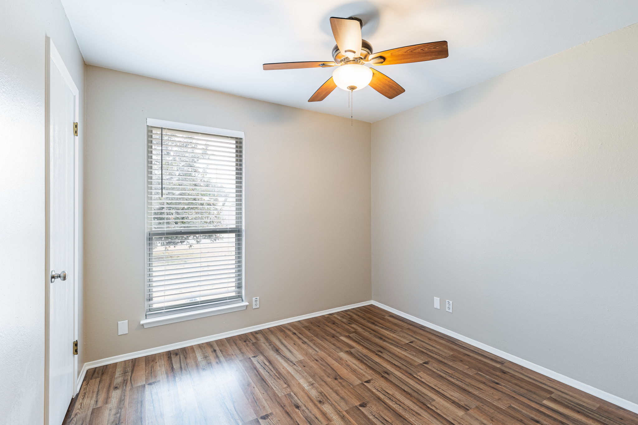 12914 Pegasus Street Austin, TX 78727 - Photo 20 of 30 Empty room featuring dark wood-type flooring and a ceiling fan