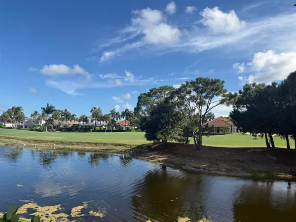 a view of a lake with a yard