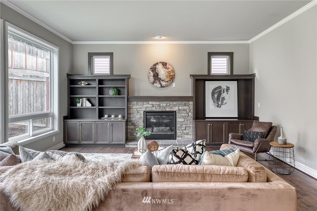 20216 85th Place Northeast Bothell, WA 98011 - Photo 14 of 33 a living room with furniture a large window and a fireplace