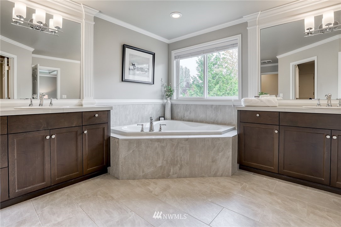 20216 85th Place Northeast Bothell, WA 98011 - Photo 22 of 33 a bathroom with a tub sink and mirror