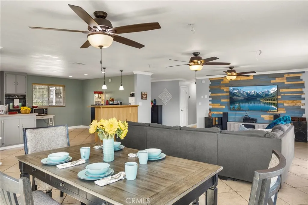 8861 Los Coches Road, Unit 1 Lakeside, CA 92040 - Photo 11 of 45 a dining room filled chandelier and kitchen view