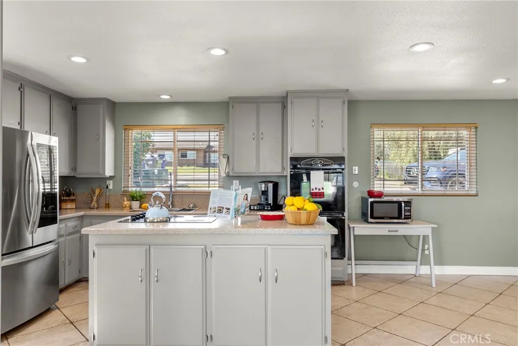 8861 Los Coches Road, Unit 1 Lakeside, CA 92040 - Photo 15 of 45 a kitchen that has a sink cabinets counter space and appliances
