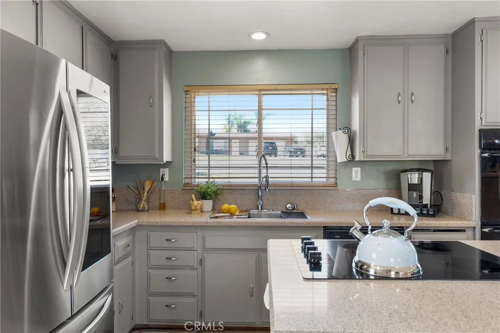 8861 Los Coches Road, Unit 1 Lakeside, CA 92040 - Photo 16 of 45 a kitchen with a refrigerator and a sink