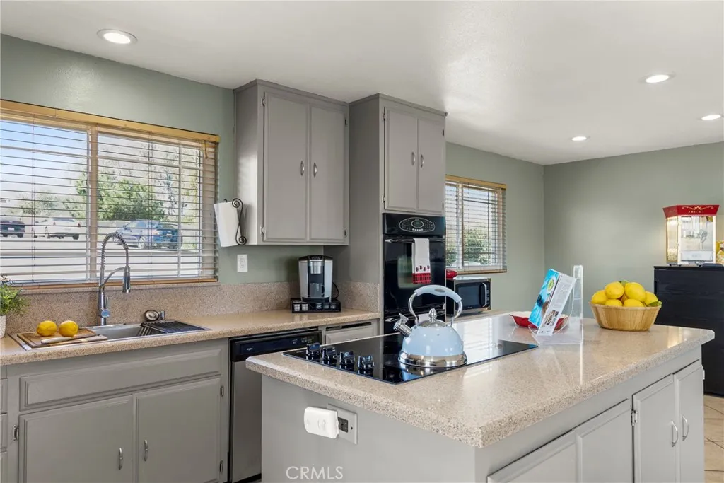 8861 Los Coches Road, Unit 1 Lakeside, CA 92040 - Photo 18 of 45 a kitchen with a sink and a stove