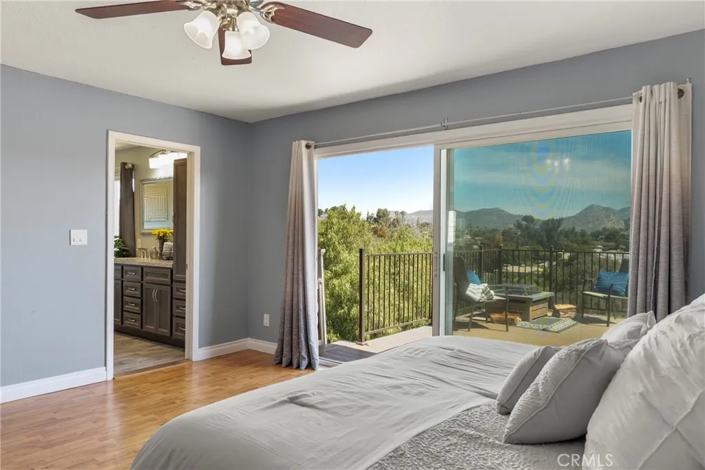 8861 Los Coches Road, Unit 1 Lakeside, CA 92040 - Photo 22 of 45 a bedroom with a large bed and a balcony