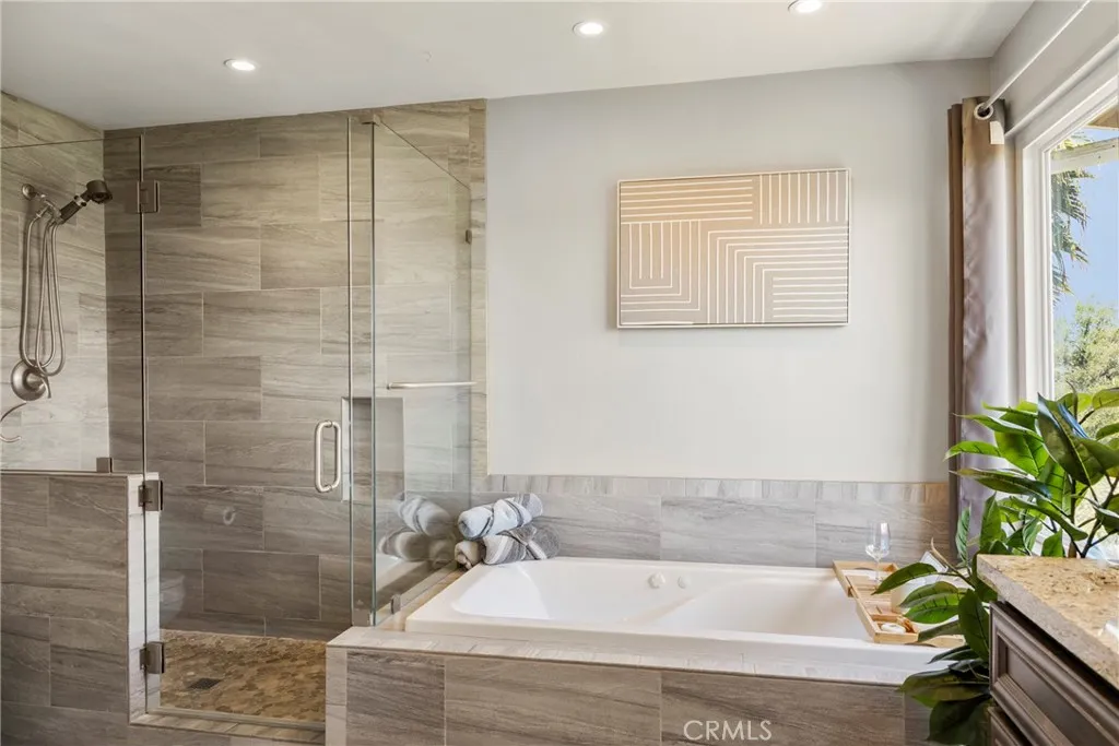 8861 Los Coches Road, Unit 1 Lakeside, CA 92040 - Photo 24 of 45 a bathroom with a bathtub and shower