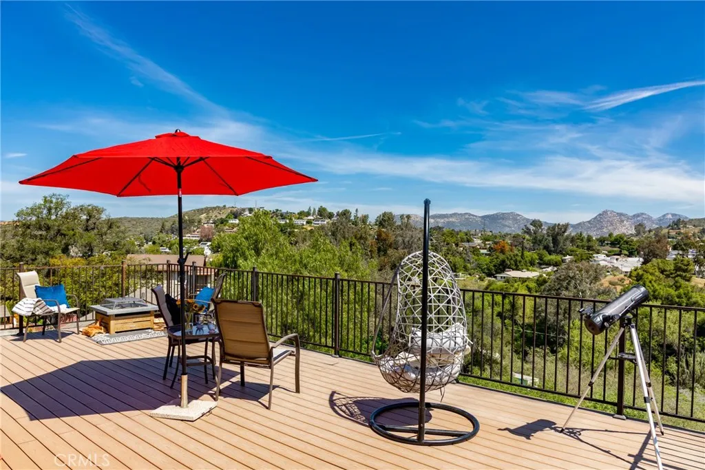 8861 Los Coches Road, Unit 1 Lakeside, CA 92040 - Photo 30 of 45 a view of a balcony with wooden floor and outdoor seating