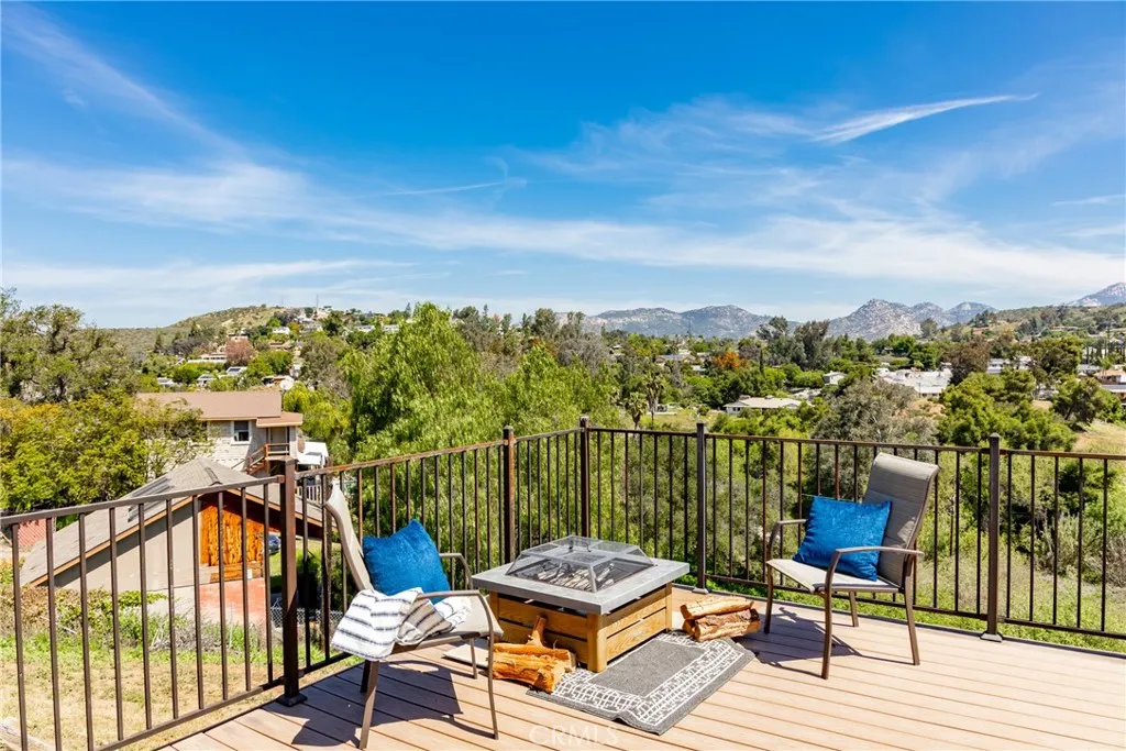 8861 Los Coches Road, Unit 1 Lakeside, CA 92040 - Photo 32 of 45 a view of a balcony with chairs and wooden floor