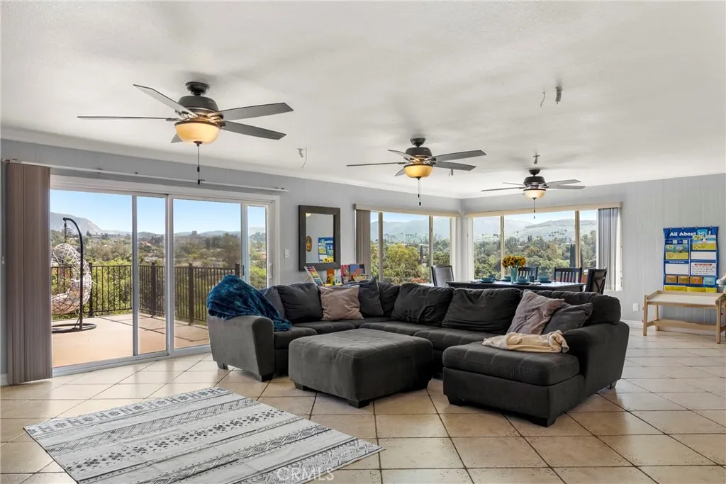 8861 Los Coches Road, Unit 1 Lakeside, CA 92040 - Photo 6 of 45 a living room with furniture ceiling fan and a large window