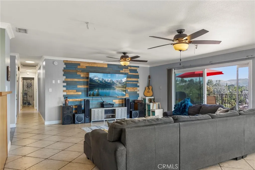 8861 Los Coches Road, Unit 1 Lakeside, CA 92040 - Photo 10 of 45 a living room with furniture and a chandelier