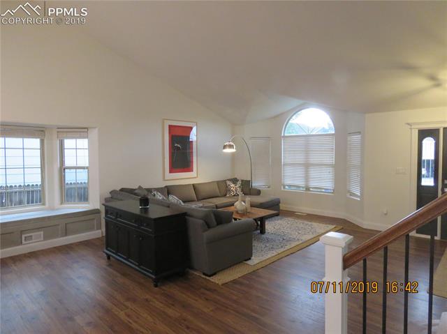 7799 Julynn Road Colorado Springs, CO 80919 - Photo 4 of 27 From the landing, this living room has it all.
