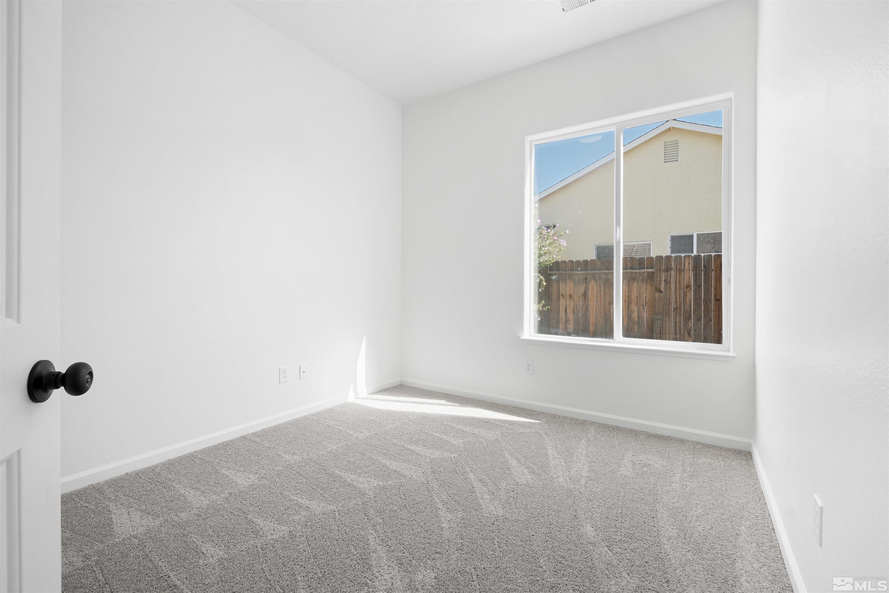 1043 Brierwood Lane Fernley, NV 89408 - Photo 13 of 27 a view of an empty room with a window
