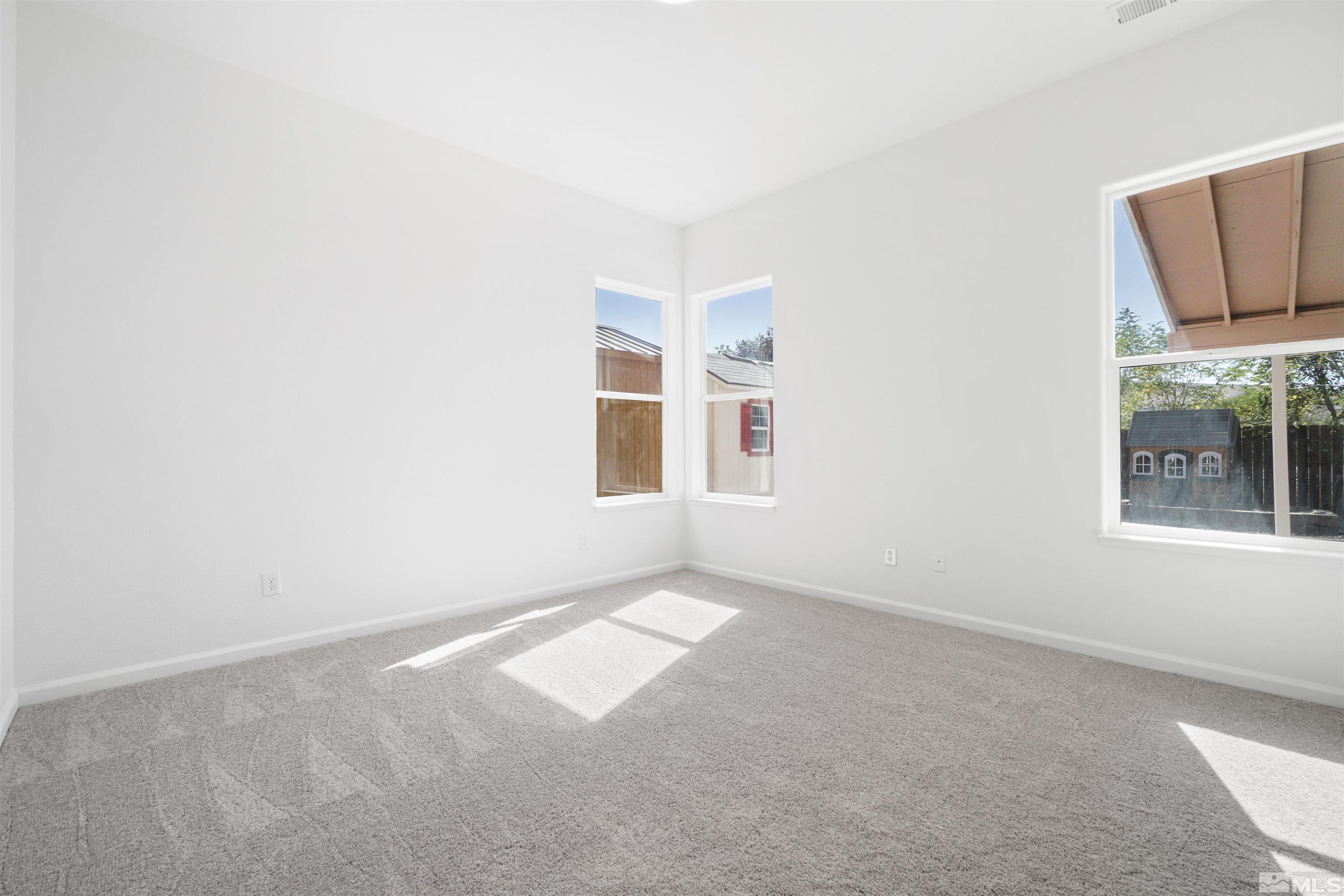 1043 Brierwood Lane Fernley, NV 89408 - Photo 14 of 27 an empty room with windows