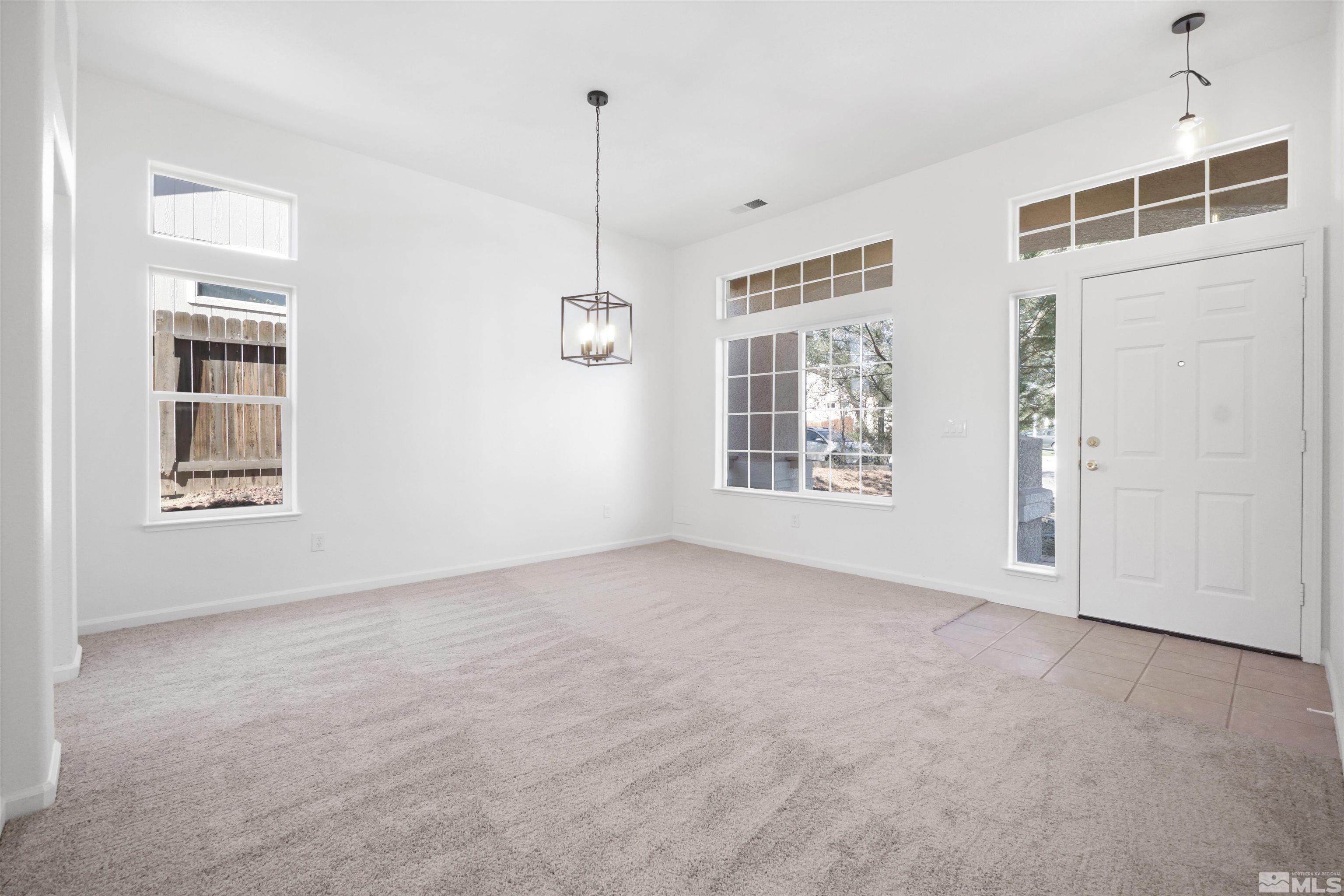 1043 Brierwood Lane Fernley, NV 89408 - Photo 15 of 27 a view of an empty room with windows