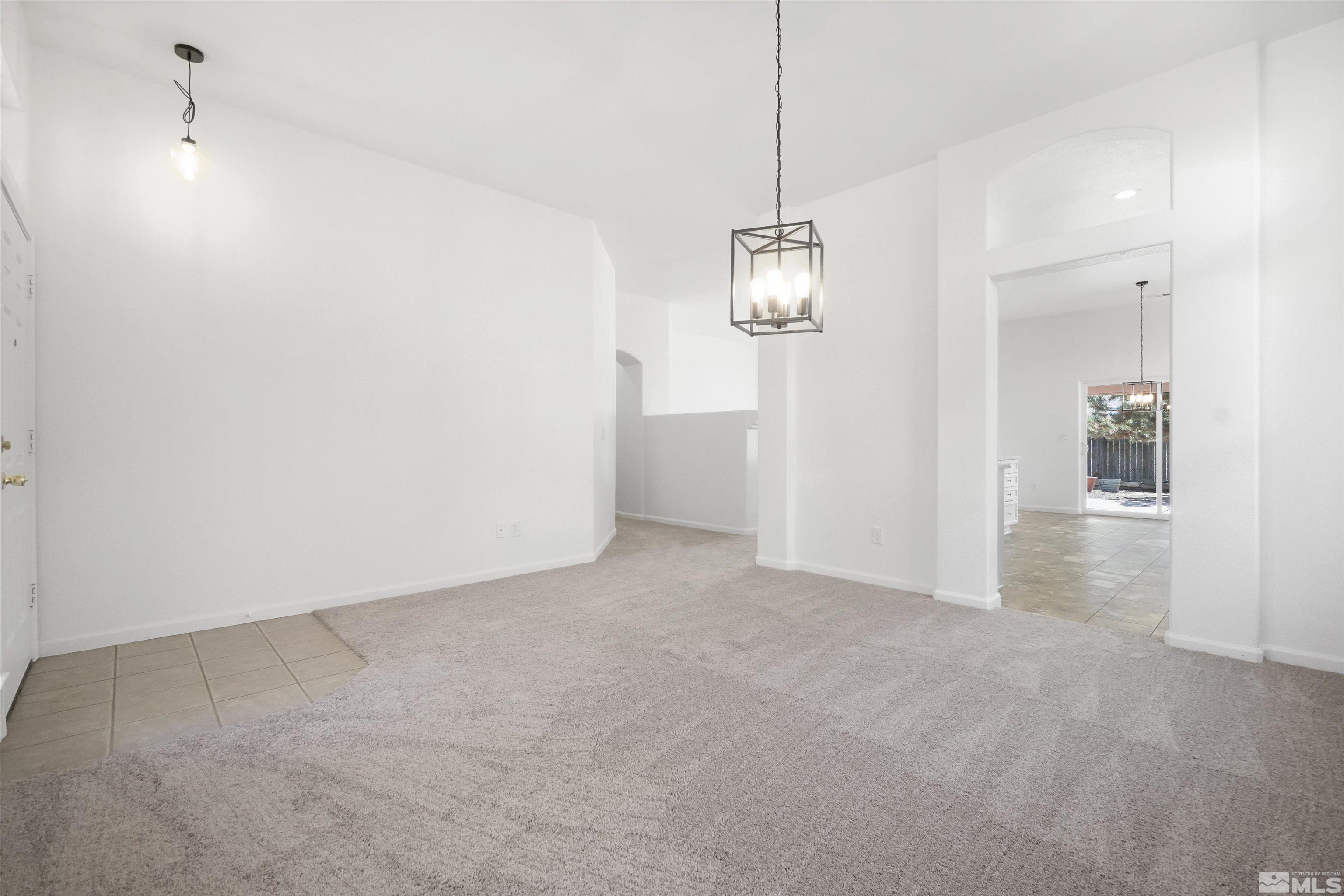 1043 Brierwood Lane Fernley, NV 89408 - Photo 17 of 27 a view of empty room with wooden floor