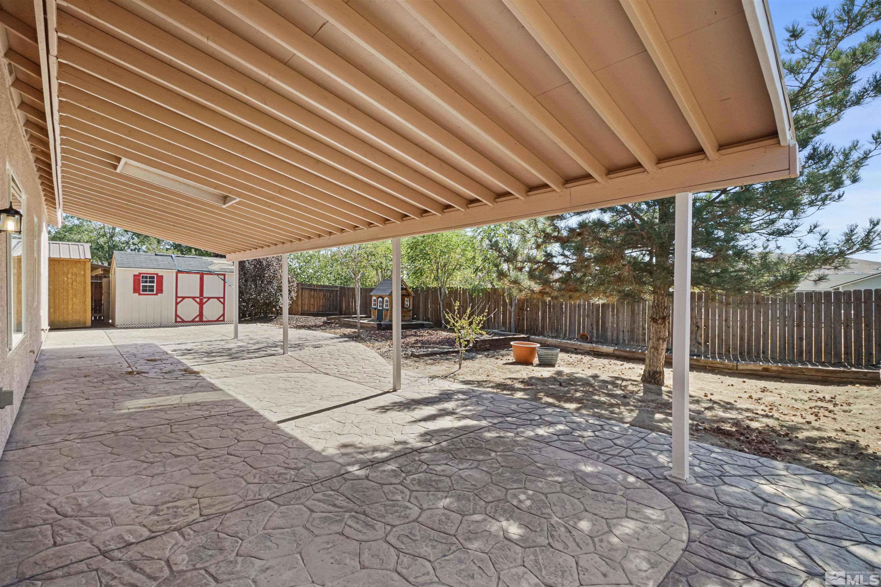 1043 Brierwood Lane Fernley, NV 89408 - Photo 22 of 27 a view of a backyard with sitting area