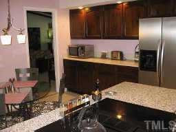 7229 Kemp Road Raleigh, NC 27613 - Photo 3 of 12 Eat-in Kitchen has been updated with Granite center island and much more. Other