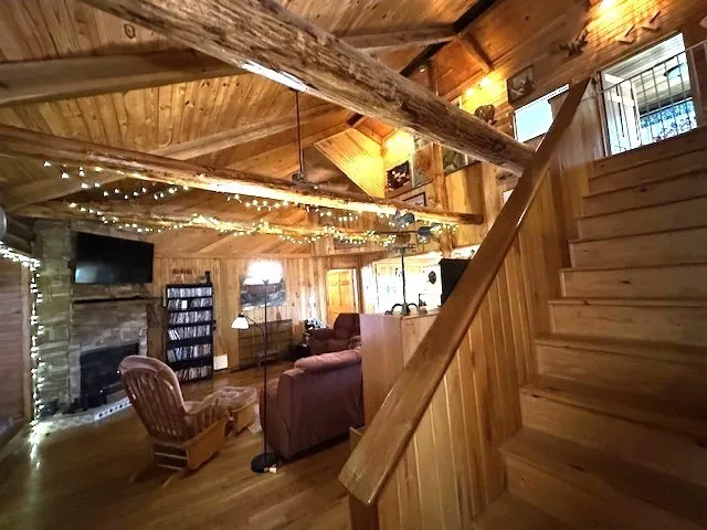 a kitchen with stainless steel appliances granite countertop a sink refrigerator and cabinets