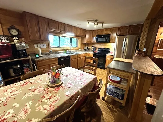 a bathroom with a toilet and a shower curtain