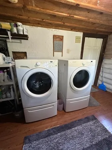 a bedroom with a bed window and a couch