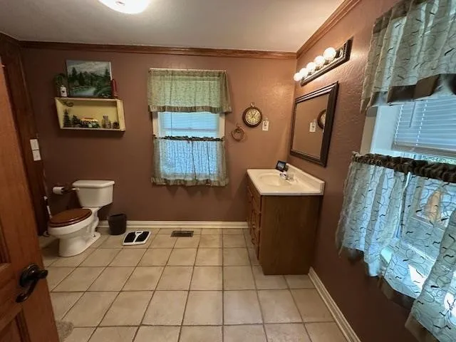 a bathroom with a toilet and shower