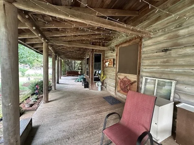 a view of a chairs room with wooden floor