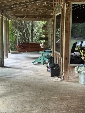 a backyard of a house with barbeque oven