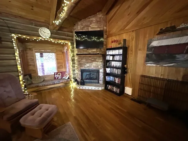 a view of a livingroom with furniture and a fireplace
