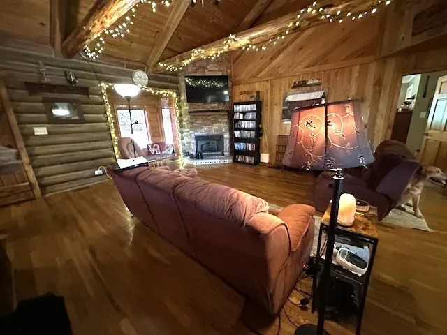a dining room with furniture and wooden floor