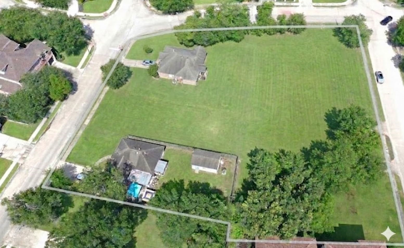 5514 McCulloch Circle Houston, TX 77056 - Photo 7 of 10 an aerial view of a house with a yard lake swimming pool and outdoor seating