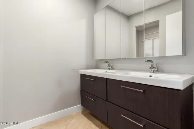 an empty room with a ceiling fan and a window