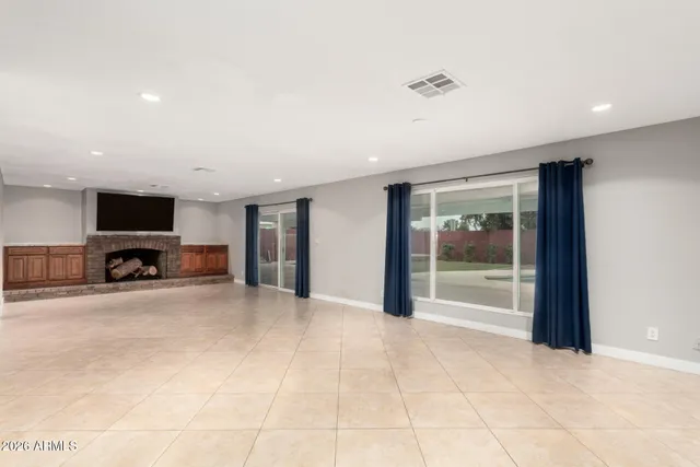 a view of living room with furniture and a flat screen tv
