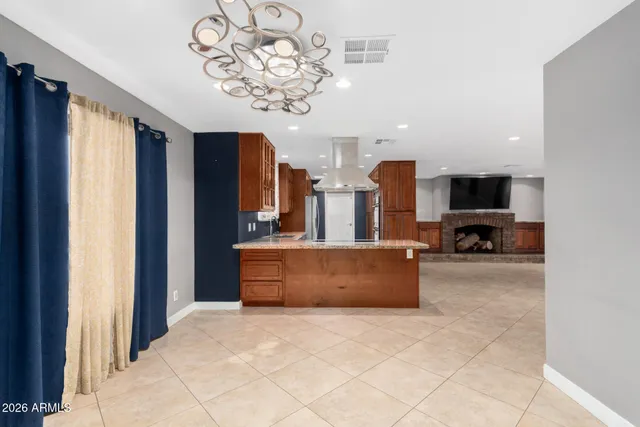 a kitchen with stainless steel appliances granite countertop a refrigerator and a sink
